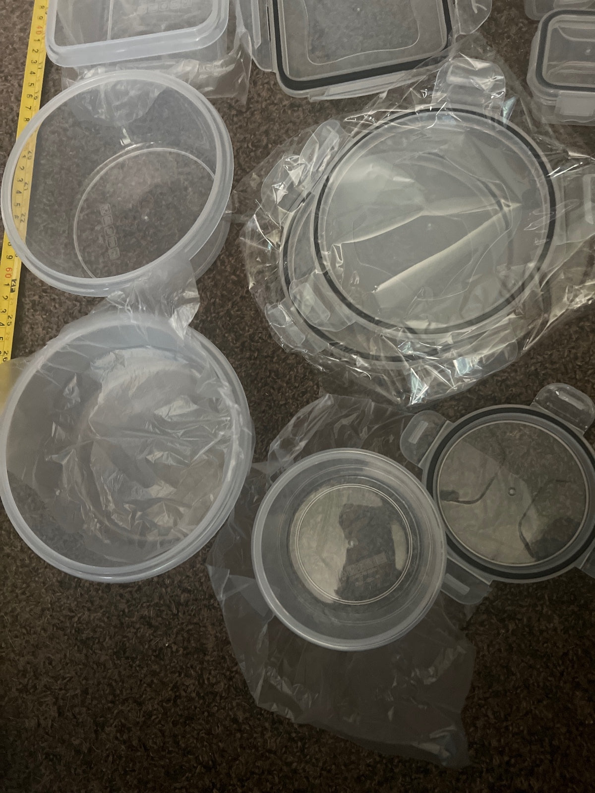 Set of Various Plastic Food Storage Containers with Labels and Measuring Spoons